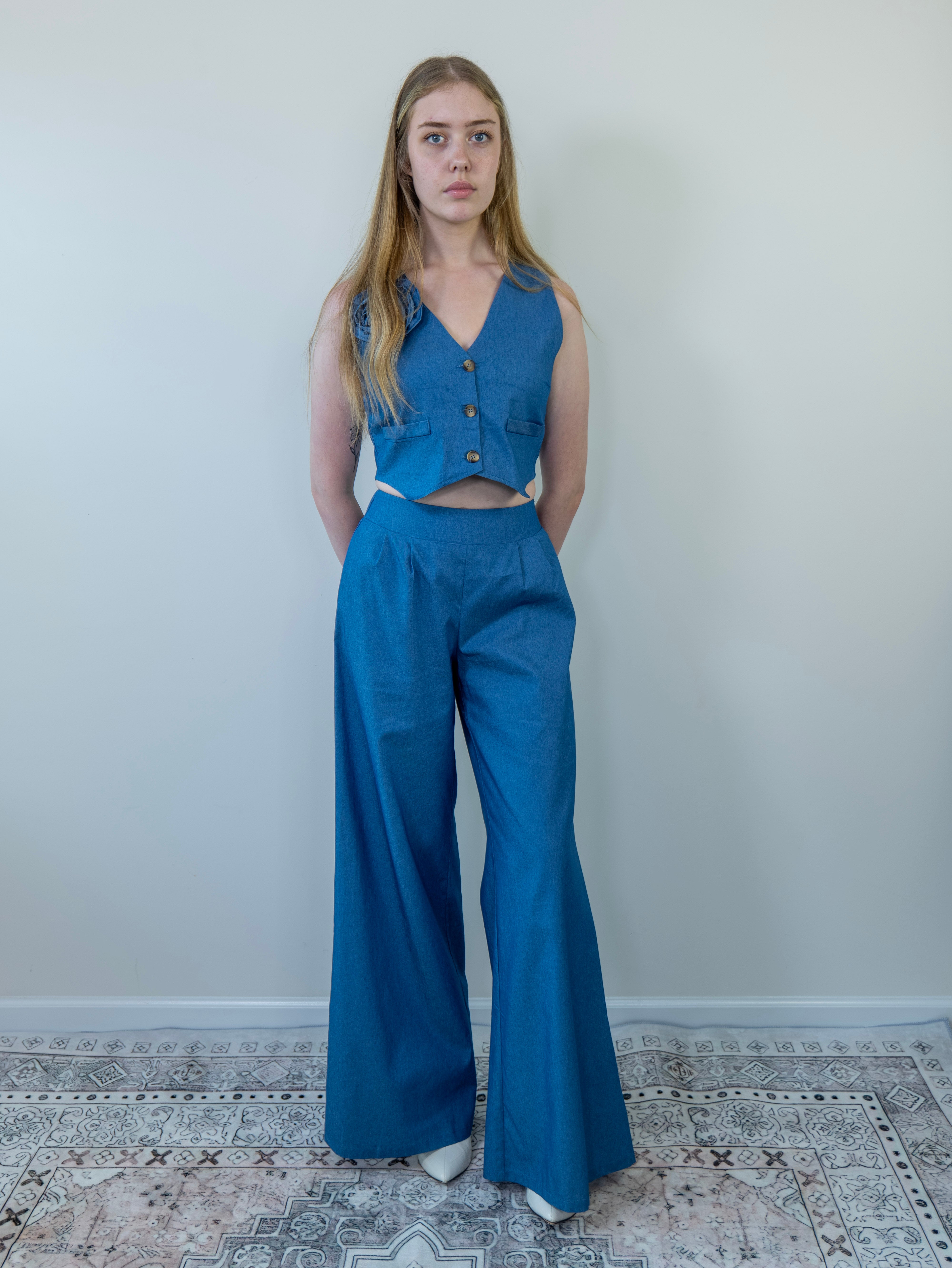 Model showing wide-leg pant movement, full body view