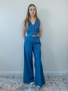 Model showing wide-leg pant movement, full body view
